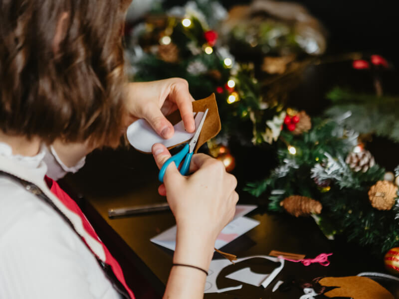 Woman cutting felt Christmas crafts